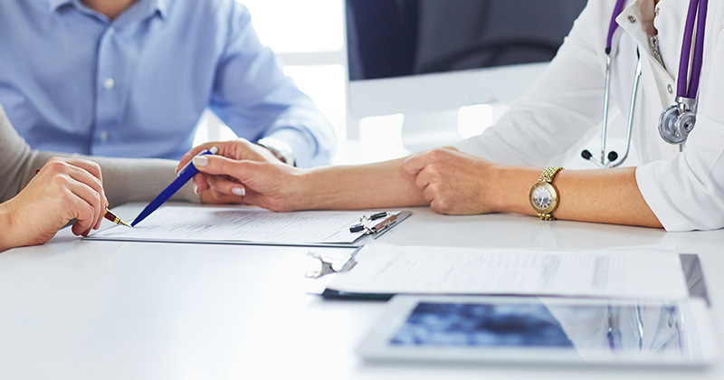 Doctor Reviewing a Patient’s Bill