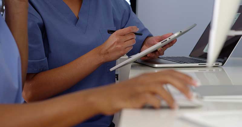 Medical Staff Holding tablet
